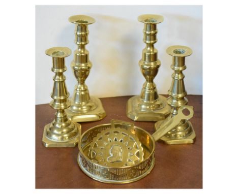 Two pairs of Victorian brass candlesticks, chamber stick and a horsebrass  