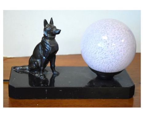 20th Century table lamp formed as a glass globe alongside a seated Alsatian dog on rectangular slate plinth, 22cm wide  