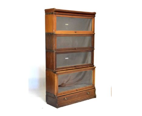 Globe Wernicke mahogany four section bookcase fitted up-and-over doors, 86cm wide  