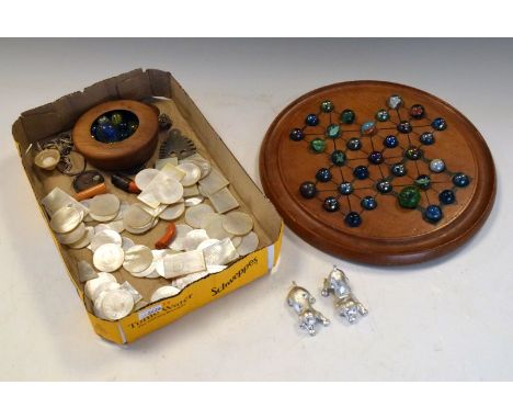 Collection of vintage gaming items comprising: marble solitaire set, mother-of-pearl gaming tokens etc  