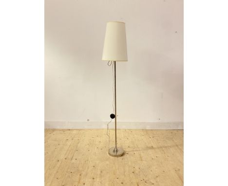 A contemporary lamp standard, the chrome stem united to the circular base with a ball joint, H160cm including shade
