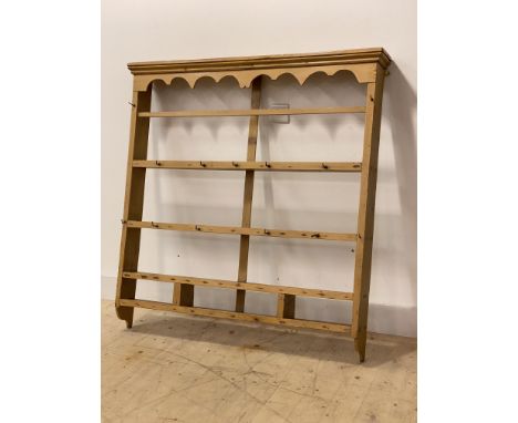 A 19th century pine four height Delft rack, the moulded cornice over shaped apron, two plate shelves and two spice shelves, H