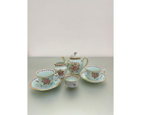 An Adams Calyx Ware part tea service with a green glaze decorated with floral posy, one tea pot, two tea cups, two saucers, m