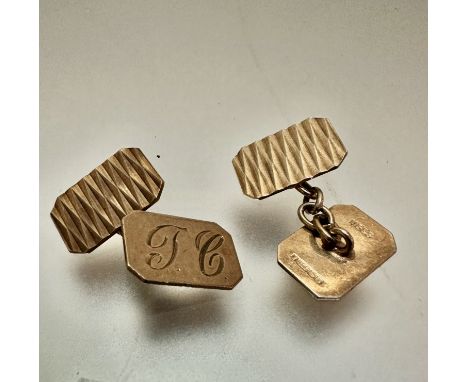 A pair of 9ct gold octagonal engine turned decorated sleeve links, initialled JC, (1.5cm x 0.5cm) weigh 4.93 grammes