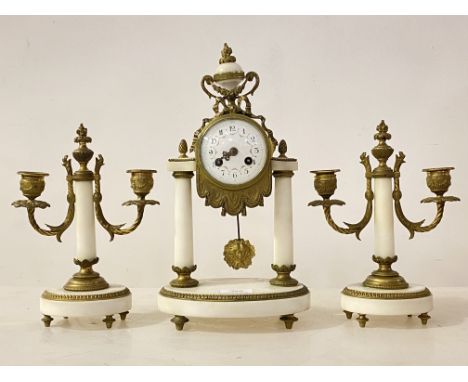 A Late 19th/ early 20th century French brass and white marble three piece clock garniture of Neoclassical design, the clock w