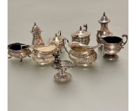 A miniature Chester silver half lobbed milk jug and two handled sugar basin and a Birmingham silver three-piece condiment set