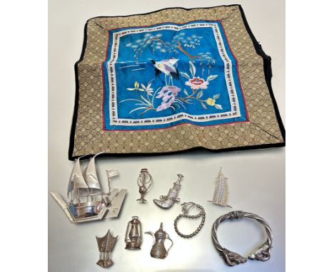 A Chinese silk work panel with two cranes and chrysanthemum design, a white metal hookah pipe, a jambalaya coffee pot, a lant
