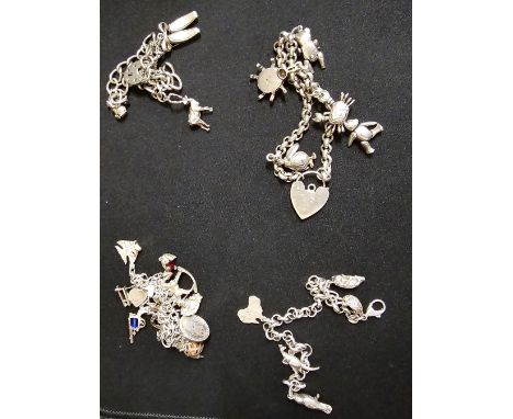 4 STERLING SILVER CHARM BRACELETS, WEIGHT APPROX 110.9 GRAMS