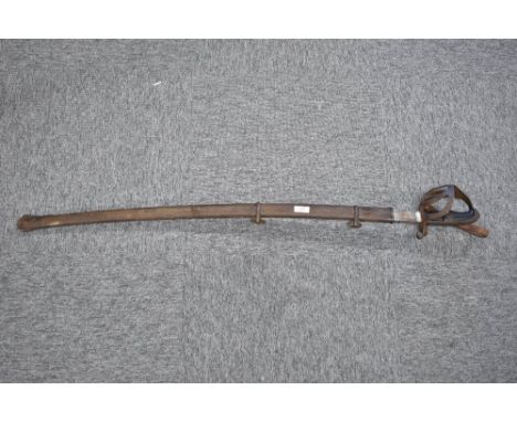 Cavalry horseman’s sabre in fair overall original condition complete with its matching metal scabbard and two ring hangers.  