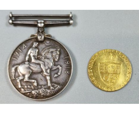 George III gold spade Guinea dated 1798. 8.6g approx. Together with WWII 1914-1918 medal, the rim marked 25982 Pte F. H. Prat