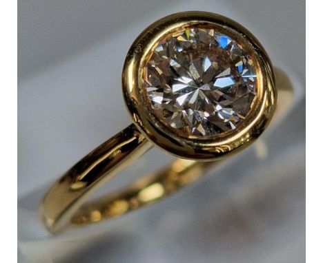 18ct gold and brilliant cut diamond solitaire ring, the diamond measuring approximately 1.2 - 1.4 carats. 4.7 g approx. Size 