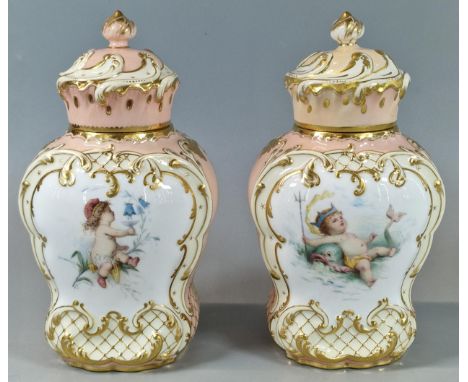 Pair of Mintons porcelain tea caddies, signed by A Boullemier, of baluster form having scrolled covers with finials and decor