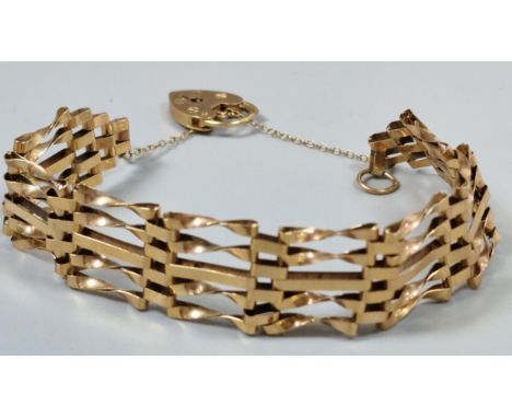 9ct gold five bar gate bracelet with heart shaped padlock. 10g approx. (B.P. 21% + VAT)