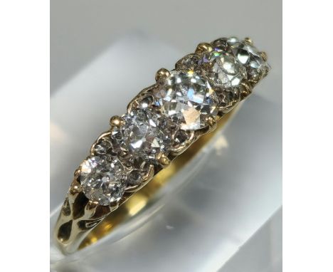 Victorian design round brilliant cut five stone diamond ring of graduated form in ornate setting. 3.5g approx. Size O. (B.P. 