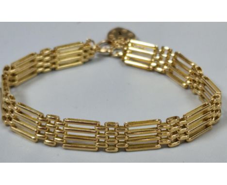9ct gold four bar gate bracelet with heart shaped padlock. 9.1g approx. (B.P. 21% + VAT)