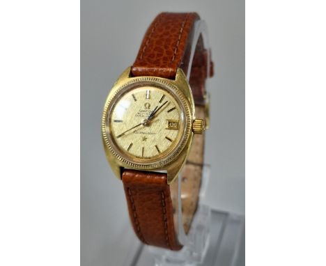 Gold ladies' Omega Constellation automatic Chronometer wristwatch, having gilt face with baton numerals, sweep seconds hand a