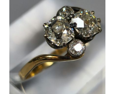 18ct gold brilliant round cut four stone diamond cluster ring. 2.7g approx. Size Q. (B.P. 21% + VAT).&nbsp;Larger diamonds 0.