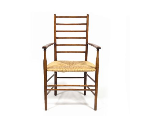 In the Manner of Ernest Gimson Armchair rush seat, ladder back, turned details 98cm high