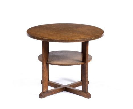 In the manner of Heals Oak coffee table round top made from four pieces of wood over a single shelf, cross braced legs 63cm, 