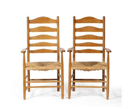 Cotswold School Pair of ash armchairs ladder-back, rush seats and turned supports and legs each 106cm high