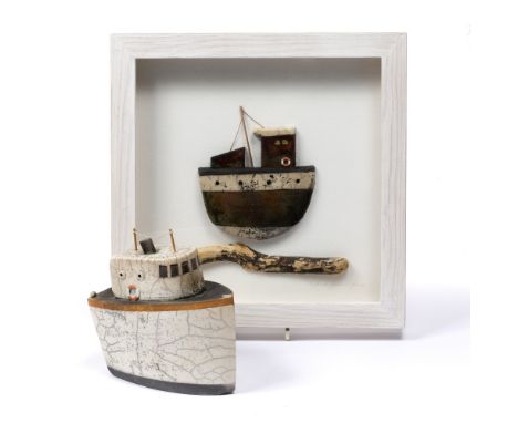 Richard Goodwin-Jones (British 20th Century) Two ceramic models of fishing boats one contained in a frame with driftwood one 