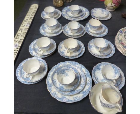 BLUE AND WHITE TEA SERVICE. Blue and white part tea service with floral detail, thirty nine pieces