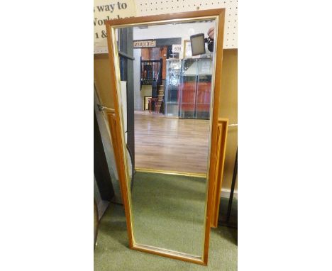 FOUR MIRRORS. Three pine framed mirrors and one light oak mirror, largest 112 x 40cm