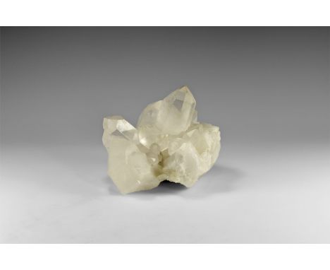 A group of large, transparent and well-formed quartz crystals on a massive quartz matrix, forming an attractive display piece