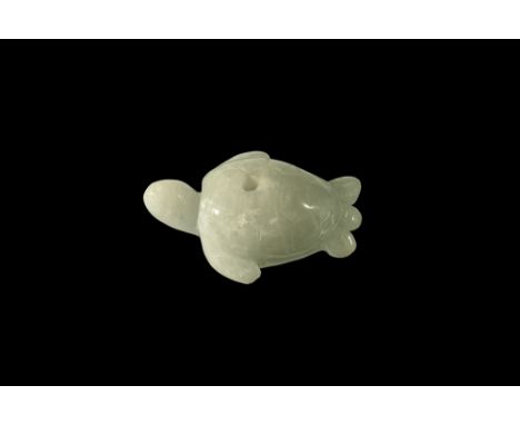20th century AD. A carved jade turtle modelled in the round, pierced centrally for suspension.  9.17 grams, 33mm (1 1/4"). UK