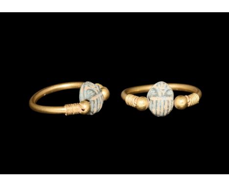 Late Period, 664-332 BC. A gold stirrup ring with round bodied shank terminating with bands of wire to the shoulder and ball 