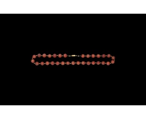 15th-18th century AD. A restrung necklace of facetted carnelian beads with gold spacer beads between.  41.93 grams, 45.5cm (1