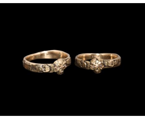 18th century AD. A D-section gold hoop with skeleton to each shoulder, the bezel a facing skull with inset diamond to each ey