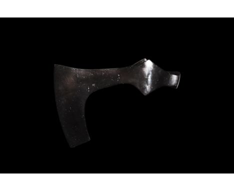 9th-11th century AD. A small hand-forged iron axehead with hooked blade, slightly curved edge, socket with lateral flanges an