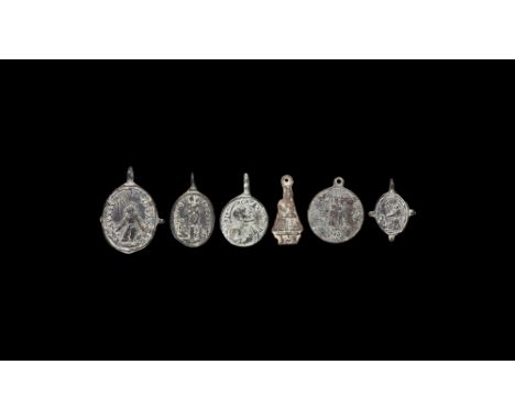 18th-19th century AD. A group of six Spanish Catholic medallions including: one in the shape of Our Lady of Guadelupe holding