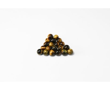 A group of twenty gold tiger eye spheres, undrilled, in white card tray. See Bonewitz, Dr. Ronald Louis, Rocks & Minerals, 20