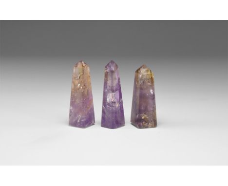 A group of three ametrine obelisks with good color variation, in white card tray. See Bonewitz, Dr. Ronald Louis, Rocks & Min