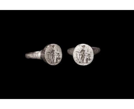 3rd century AD. A D-section silver hoop with geometric detailing to the shoulders, drum-shaped bezel with incised undulating 