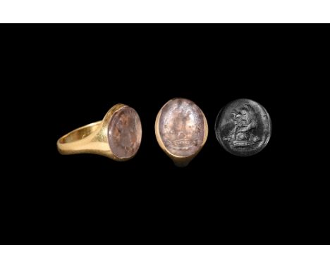 16th-17th century AD. A D-section gold hoop supporting a discoid plaque with inset foiled rock crystal cloison, intaglio hera