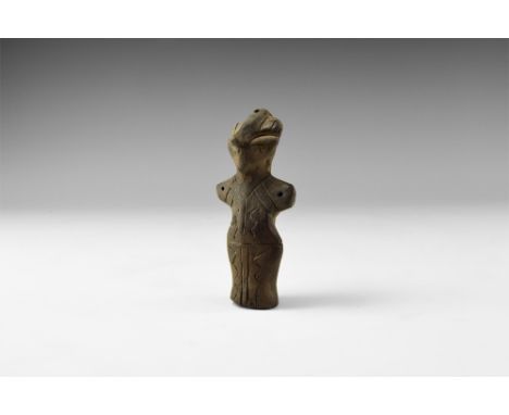 Neolithic, 6th-4th millennium BC. A ceramic figurine of a standing female with prominent nose and hair, stub arms extended, i