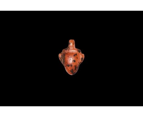 New Kingdom, 1550-1070 BC. A hardstone amuletic pendant of a heart with pierced lug above. Cf. Andrews, C. Amulets of Ancient