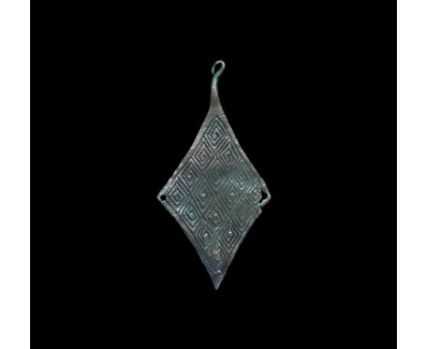 8th-9th century AD. A flat-section lozenge plate brooch with lateral piercings and hooked catchplate to the lower angle; the 