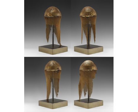 17th-18th century AD. An iron kulah khud helmet with hemispherical bowl decorated with scrolling plant motif and calligraphic
