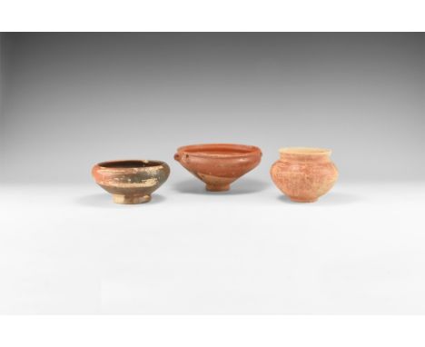 5th-3rd century BC. A mixed group of burnished ceramic vessels comprising: a skyphos with scrolled handles; a jar with flared