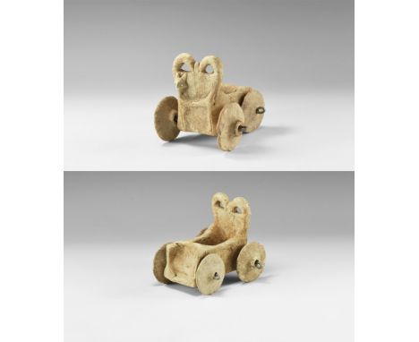 2nd millennium BC. A rectangular ceramic cart with stepped parapet, vertical sides with incised herringbone motifs, tall rear