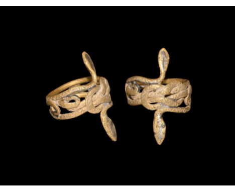 1st century BC-1st century AD. An openwork gold hoop formed as two serpents with addorsed head, Hercules knot and looped tail