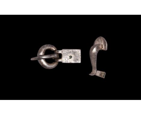 2nd-5th century AD. A mixed silver group comprising: a knee brooch with facetted body, D-shaped headplate, scooped foot, exte