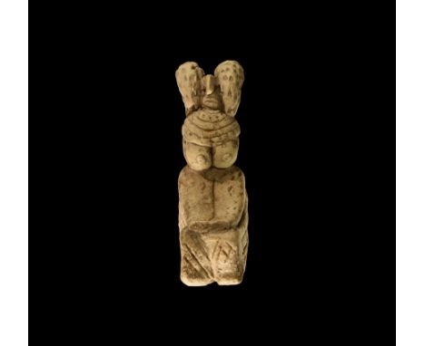 4th-3rd millennium BC. A ceramic figurine of a seated female with tufts to the shoulders, multi-strand collar, arms beneath t