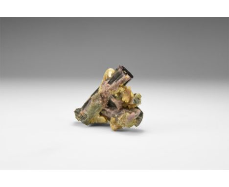 A cluster of three major, mixed colour tourmaline crystals and several smaller ones, with feldspar, in white card tray. See B