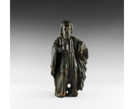 15th century AD. A carved wooden architectural figure of a saint(?) or dignitary in loose robes, with neat beard and styled h