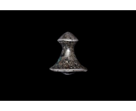 3rd century BC-3rd century AD. A silver mount with slider bar to the reverse, flared base, biconvex finial.  25 grams, 27mm (